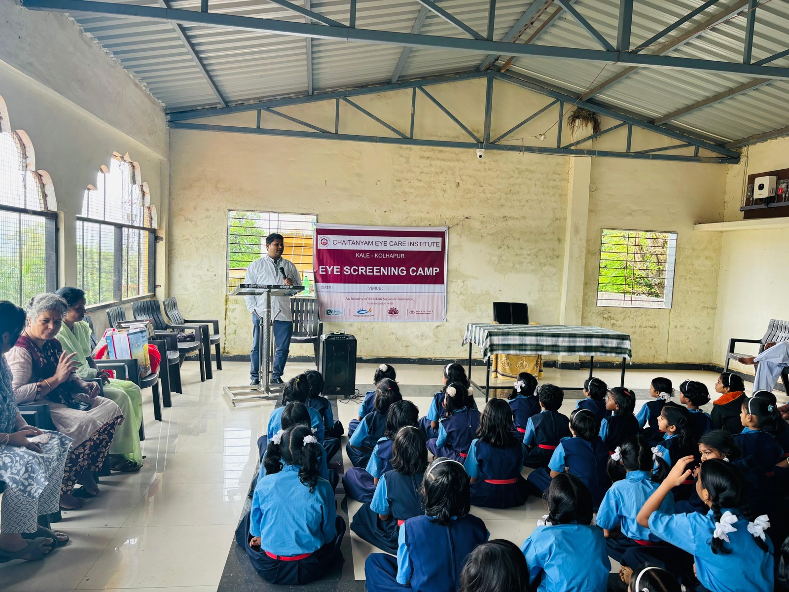 Mobile eye care van with school children at a village outreach visit